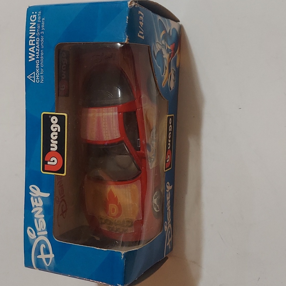 Disney Donald corvette  made by burago. Scale is 1/43 , new in box .